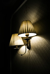 Image showing Photo of wall lamp with dim light   