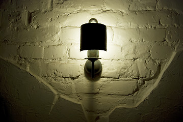 Image showing Photo of wall lamp with dim light  