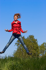 Image showing Young woman jumping