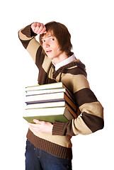 Image showing Young man holding books