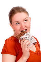 Image showing Woman eating chocolate