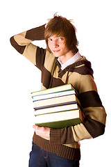 Image showing Young man holding books
