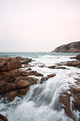 Image showing Beautiful seascape. Sea and rock at the sunset. Nature compositi