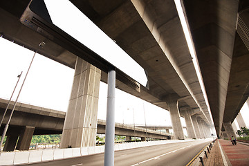 Image showing signpost beside the traffic road