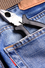 Image showing pliers in the jeans' pocket