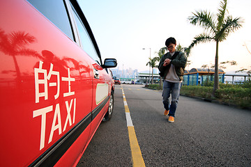 Image showing asia man going to take taxi