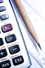 Image showing close-up of ruler,calculator,and pencil,focus on pencil-tip