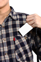 Image showing Man putting a blank card into his pocket 