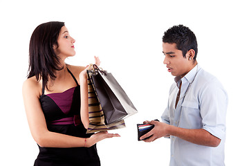 Image showing woman with shopping bags and man opened his wallet