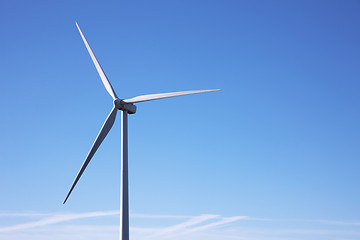 Image showing wind mill power, isolated on blue sky;