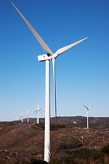 Image showing mountain with windmills power, on blue sky;