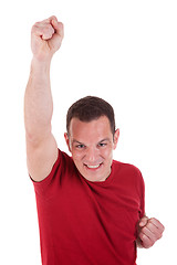 Image showing Portrait of a happy  man with his arm raised