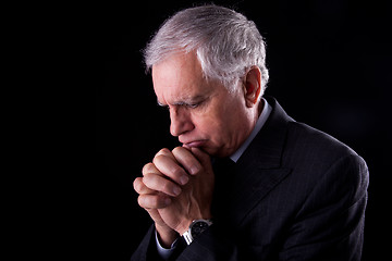 Image showing Portrait of a handsome mature businessman, thinking-praying