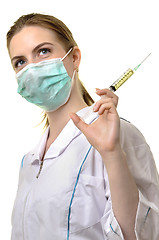 Image showing  paramedic in mask with syringe