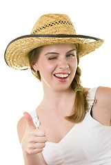 Image showing happy woman in worn straw  hat