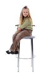 Image showing Girl sitting on a high chair, isolated
