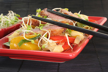 Image showing Duck breast with fried noodles