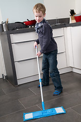 Image showing Cleaning the floor