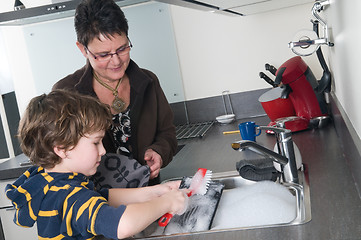 Image showing Doing the dishes with grandma