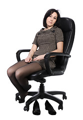 Image showing Girl in brown dress in an office chair, isolated