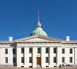 Image showing US flag at half mast on courthouse