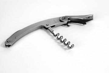 Image showing Corkscrew on white table