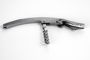 Image showing Corkscrew on white table