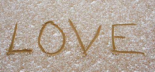 Image showing Love printed in sand