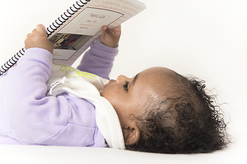 Image showing Baby reading a book