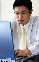 Image showing Young Asian Entrepreneur Working with Computer