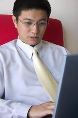 Image showing Young Asian Entrepreneur Working with Computer