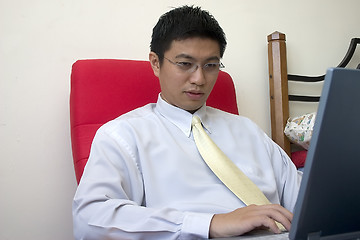 Image showing Young Asian Entrepreneur Working with Computer