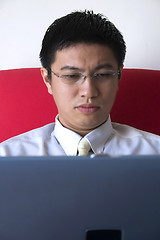 Image showing Young Asian Entrepreneur Working with Computer