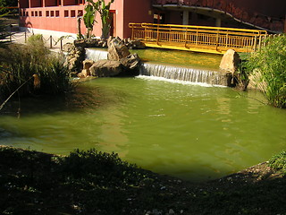 Image showing bridge over pond waterfall