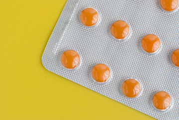 Image showing Pack of orange pills