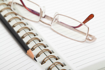 Image showing Diary, pencil and glasses