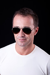 Image showing Portrait of a handsome middle-age man smiling with sunglasses