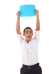 Image showing happy young latino man, raised arms with blue card in hand