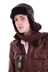 Image showing Young boy looking serious, with hat and winter clothes