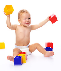 Image showing Happy little boy with building bricks