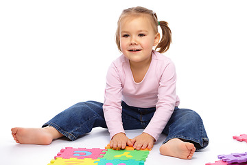 Image showing Little girl with alphabet