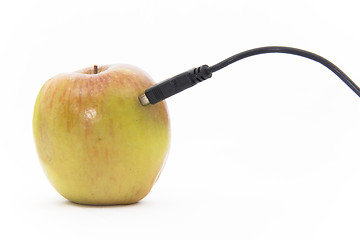 Image showing Apple plugged