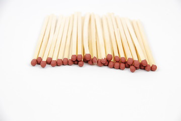 Image showing Red matches on white (close-up)