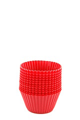 Image showing Red plastic cups for small cakes on white