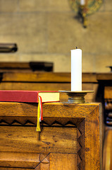 Image showing Detail of hymnal and candle