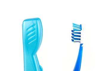 Image showing Blue and white tooth brush and case