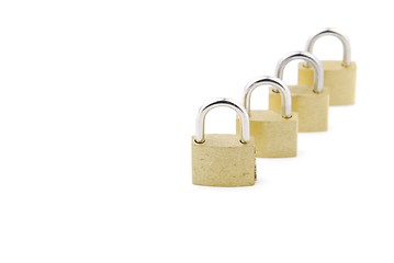 Image showing Golden closed padlocks on white