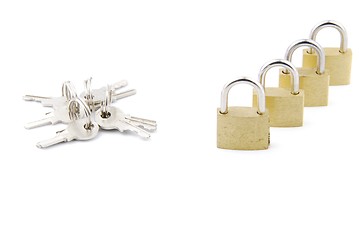 Image showing Golden closed padlocks with keys on white