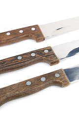 Image showing Close-up of wooden kitchen knifes on white