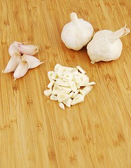 Image showing Garlic preparation ways on a cutting board